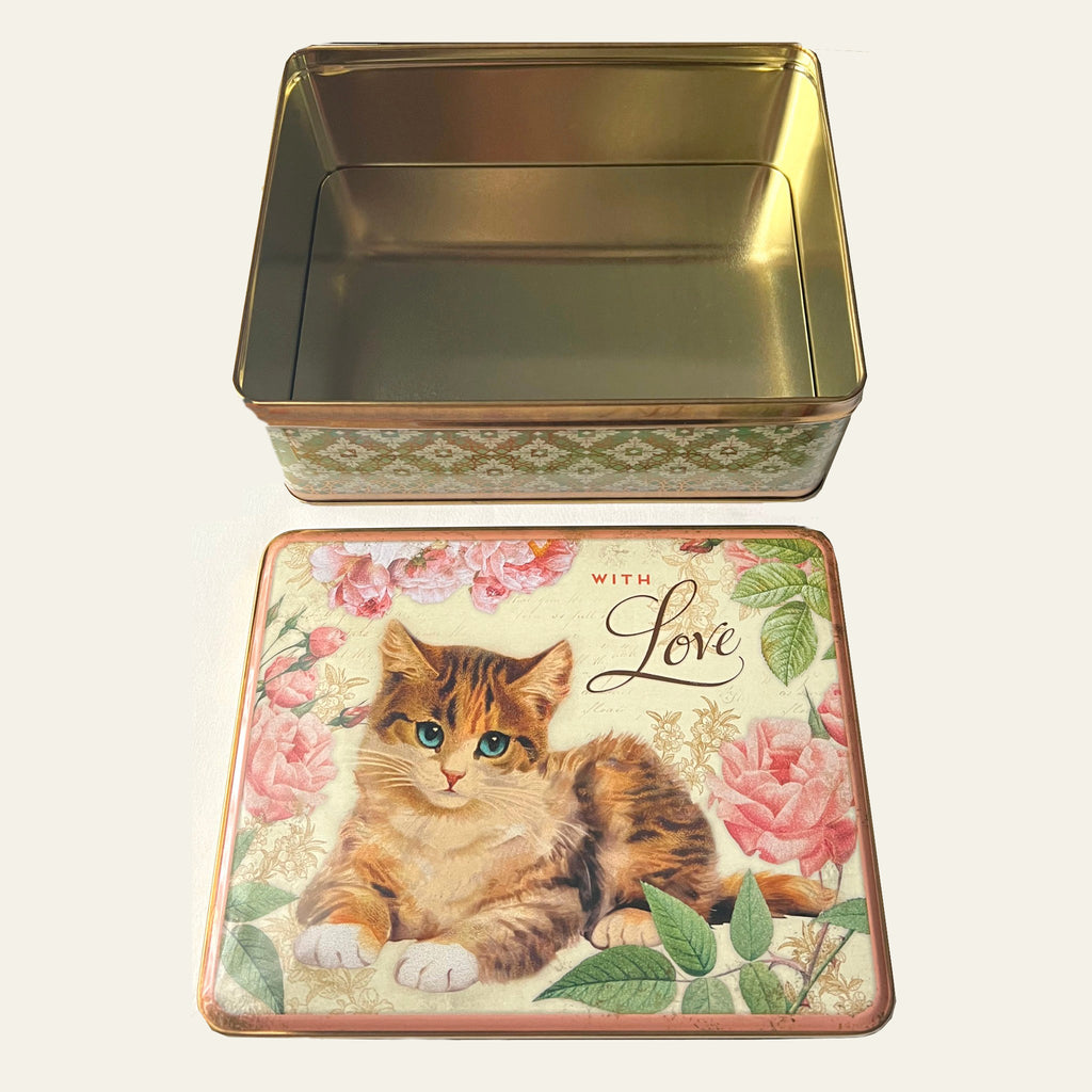 Vintage tin with a cat reproduced by Nostalgia design.