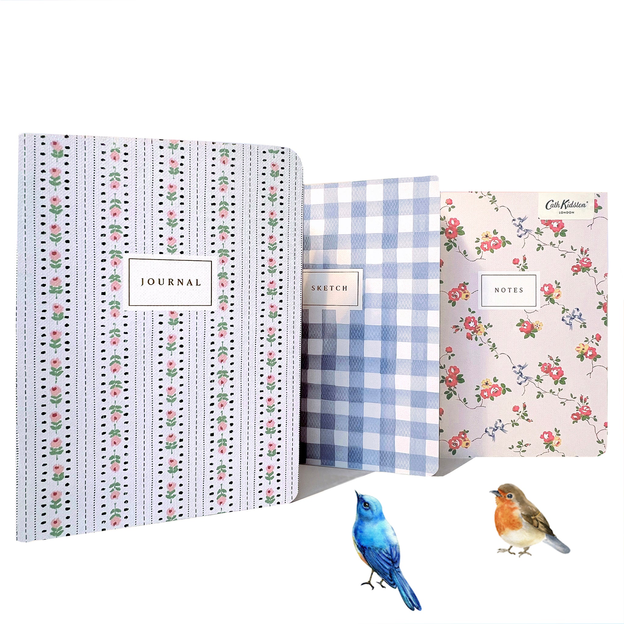 A trio of notebooks set in floral and checks by Cath Kidston.
