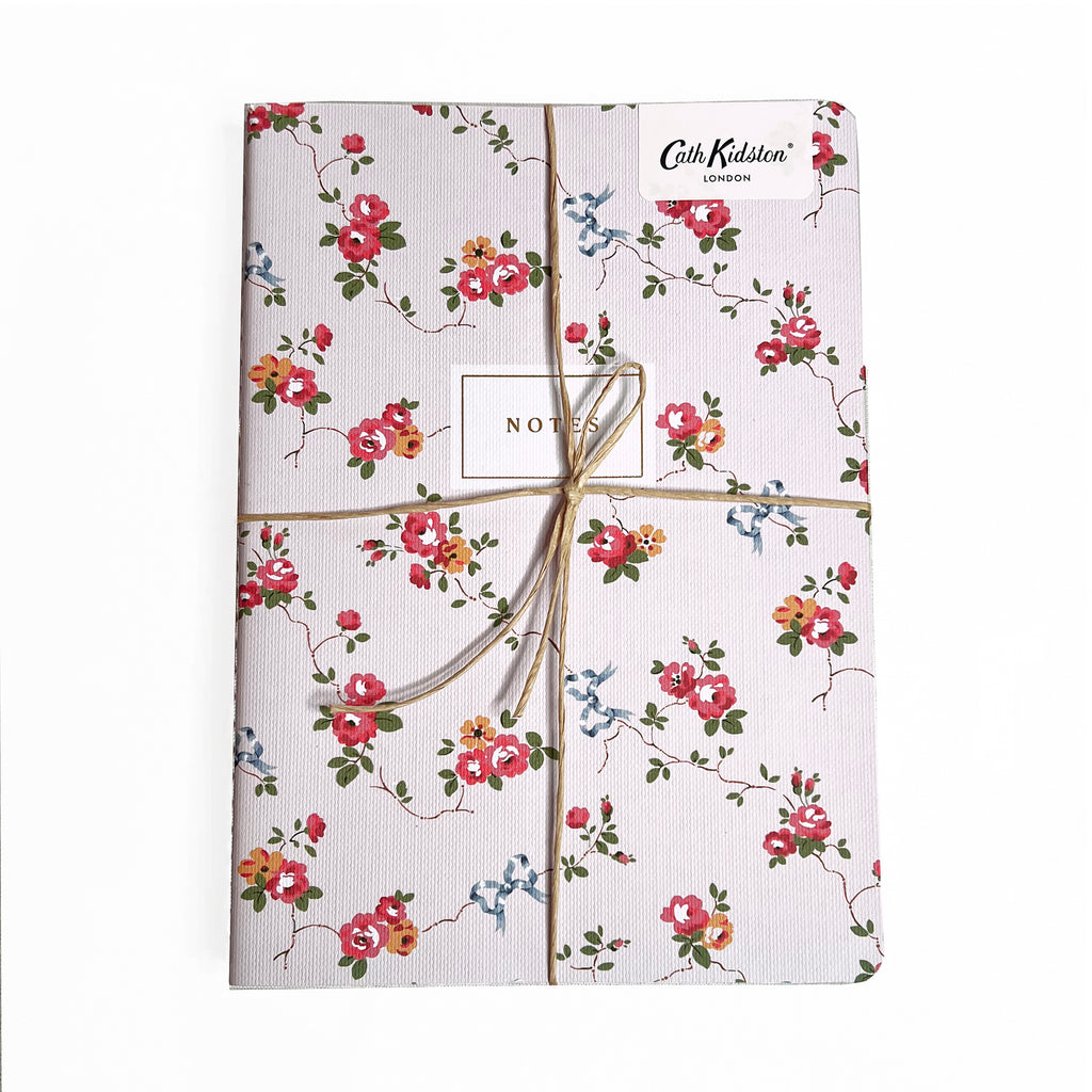 A trio of notebooks set in floral and checks by Cath Kidston.