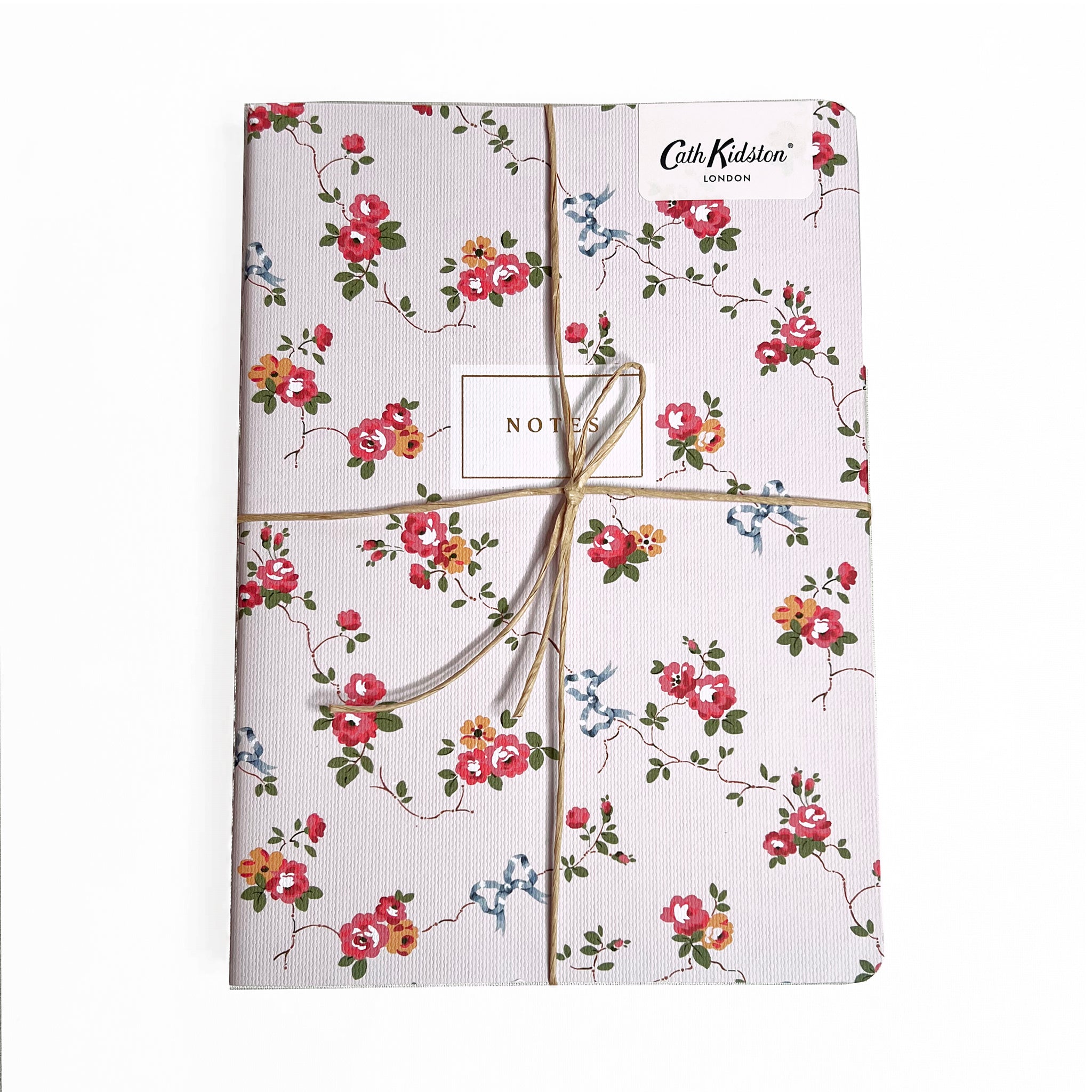 A trio of notebooks set in floral and checks by Cath Kidston.