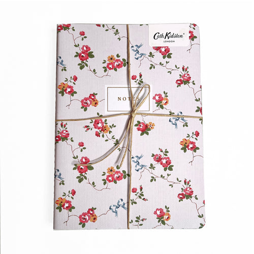 A trio of notebooks set in floral and checks by Cath Kidston.