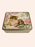 Friendly kitten on a vintage-style tin by Nostalgia design.
