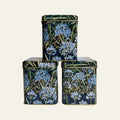 Small decorative tins (sold individually) with blue agapanthus flowers on all four sides by Arts & Crafts.
