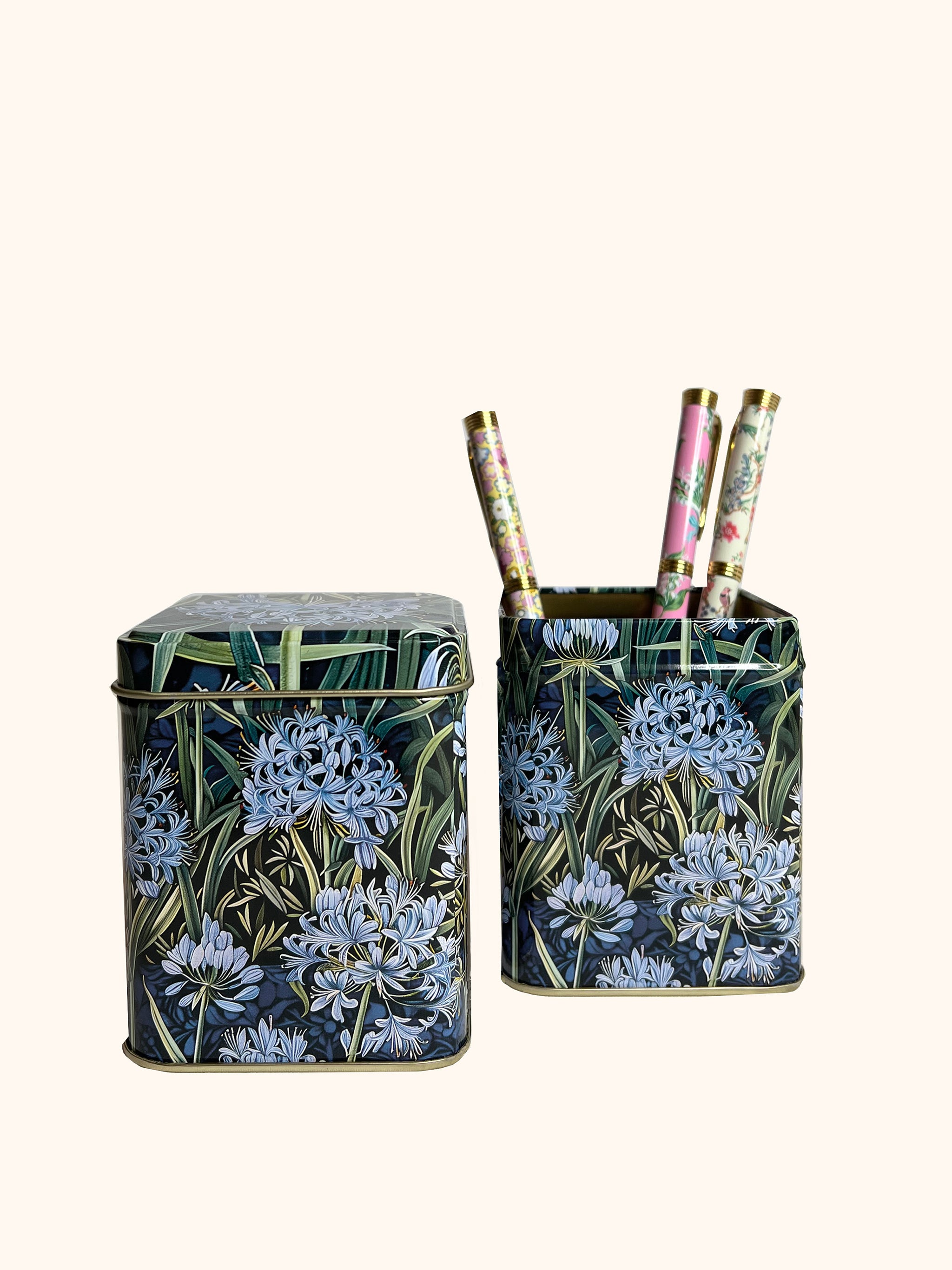 Small square tin with blue agapanthus flowers on all sides by Arts & Crafts.