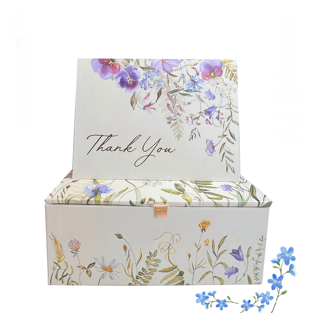 A treasure box of 20 thank-you cards with four designs and 21 lined envelopes by Peter Pauper Press, New York.