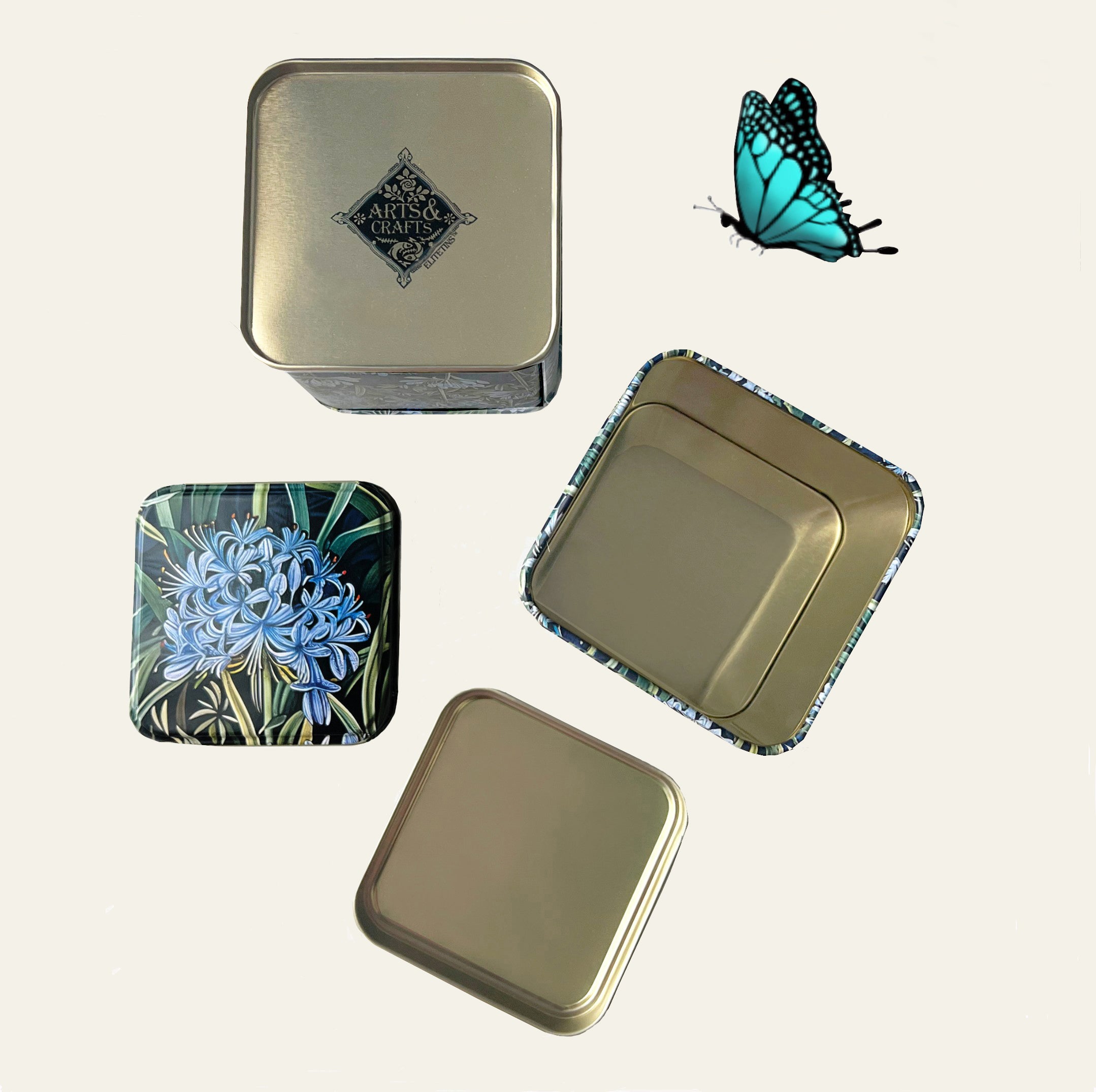 Small decorative tins (sold individually) with blue agapanthus flowers on all four sides by Arts & Crafts.